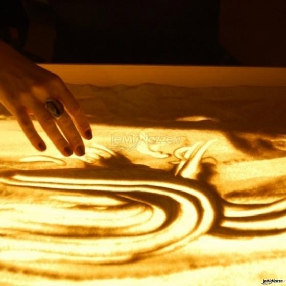 Spettacoli emozionanti di sabbia animata - Le mani dell'artista